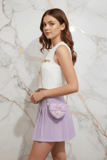 Young girl side pose - Mini Heart Barbie Bag