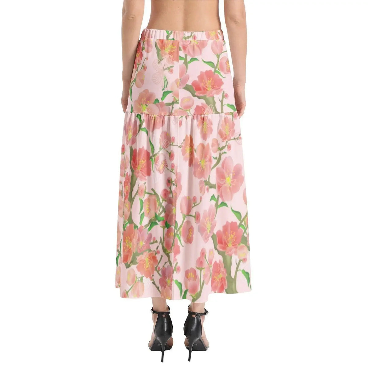 Woman wearing ivory floral elastic waist ruffle slit hem skirt, back view, from Ivorynn