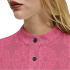 Woman wearing pink floral long sleeve button-up shirt with mandarin collar from Ivorynn
