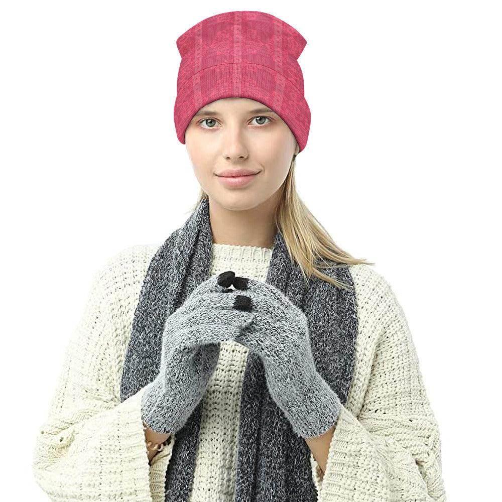 Woman wearing a pink floral knitted hat, gray scarf, and gray gloves from Ivorynn