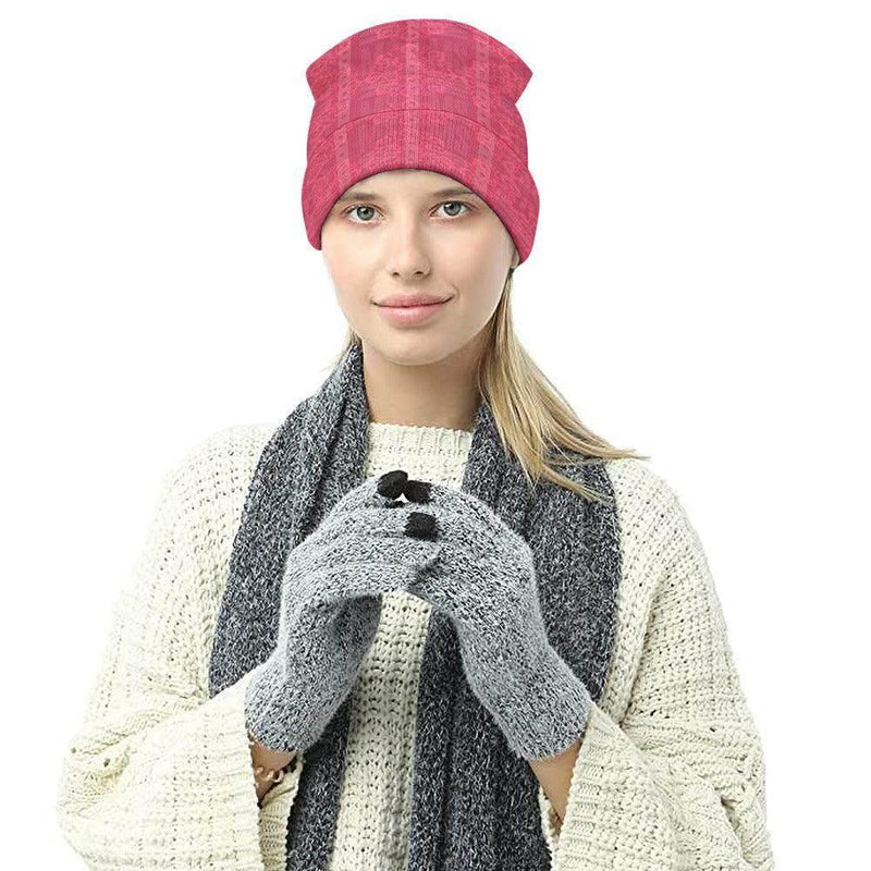 Woman wearing a pink floral knitted hat, gray scarf, and gray gloves from Ivorynn