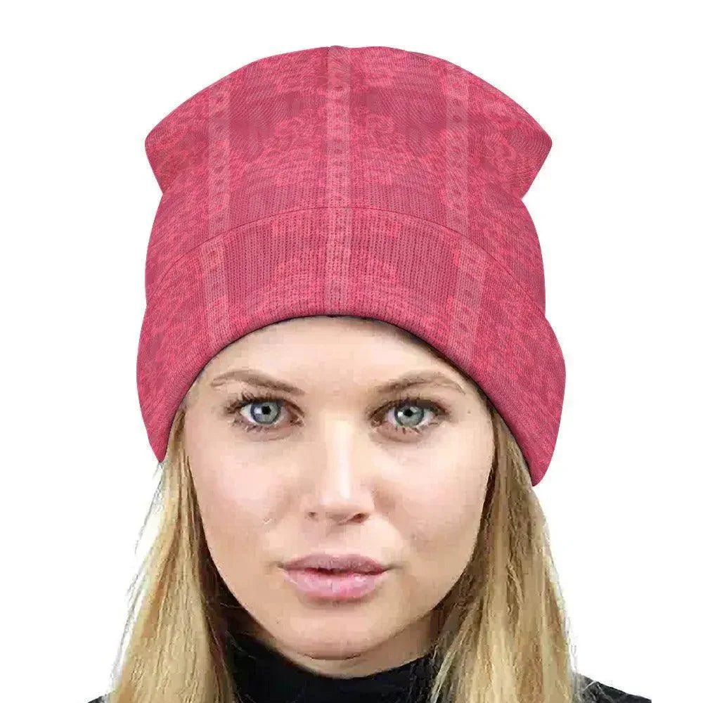 Woman wearing a pink floral knitted hat, stylish winter accessory at Ivorynn fashion store