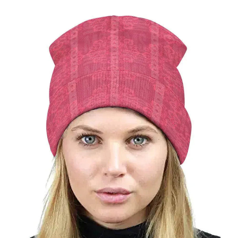 Woman wearing a pink floral knitted hat, stylish winter accessory at Ivorynn fashion store