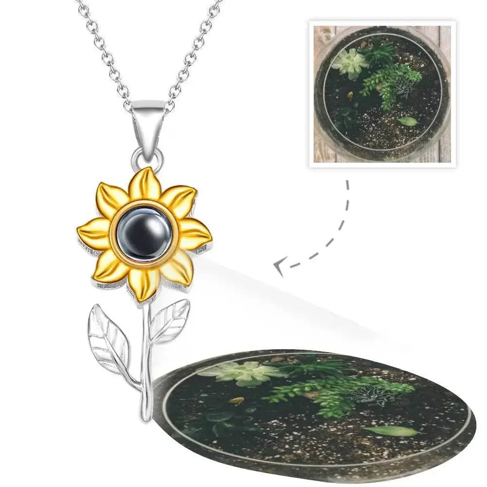 Gold sunflower pendant necklace with projection feature displaying a succulent image, Ivorynn jewelry