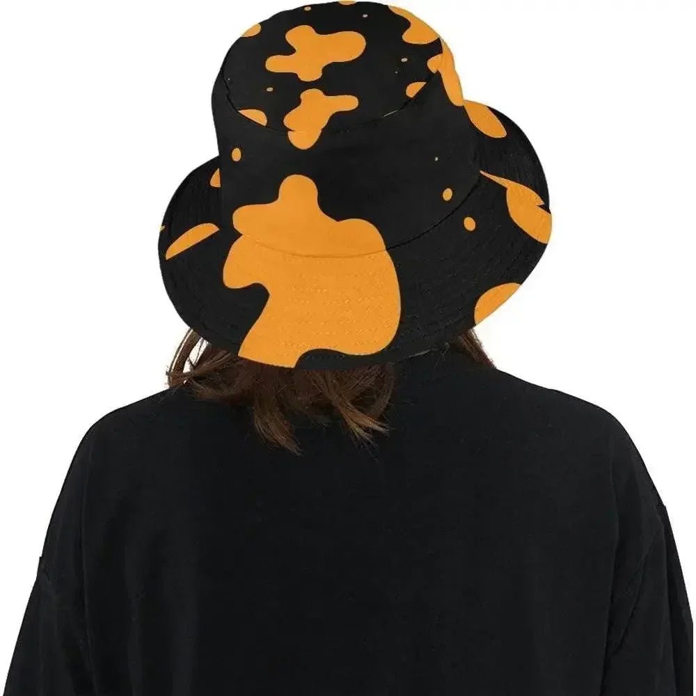 Woman wearing a black bucket hat with orange abstract spots, modern fashion by Ivorynn