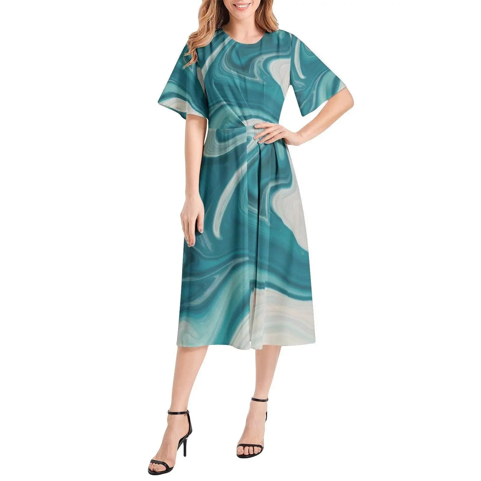 Woman modeling a teal and ivory marble print short sleeve midi dress, sold at Ivorynn