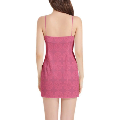 Woman modeling sleeveless pink spaghetti strap mini dress with subtle floral pattern, Ivorynn fashion
