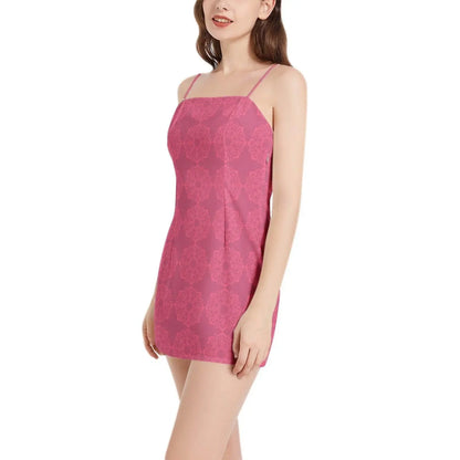 Woman modeling pink sleeveless spaghetti strap mini dress with subtle floral pattern from IVORYNN